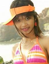 18 year old Thai teen in orange bikini at the beach