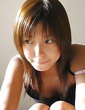 Naughty Asian slut Kana smiles as she shows off her tight ass and lovely titties